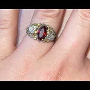 Vintage ruby ring with silver and gold leaf band